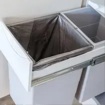 Pull-out trash system with dual compartments for luxury backyard pool and outdoor living spaces