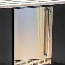 Stainless steel outdoor refrigerator integrated into luxury backyard pool entertainment area