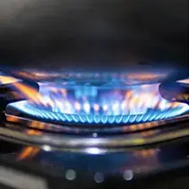 Close-up of illuminated gas burners for luxury backyard pool and outdoor entertainment spaces