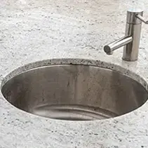 Stainless steel outdoor sink installed in luxury backyard patio design for entertaining