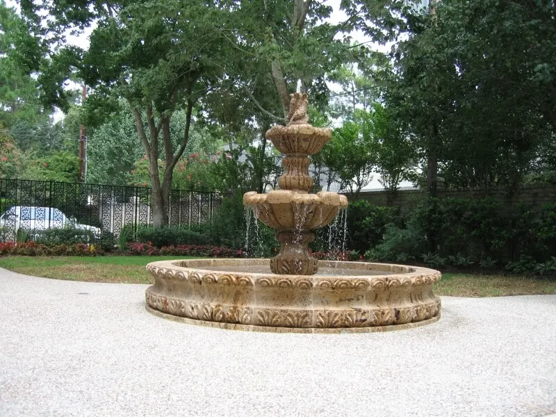Elegant tiered stone fountain centerpiece for luxury backyard outdoor living spaces