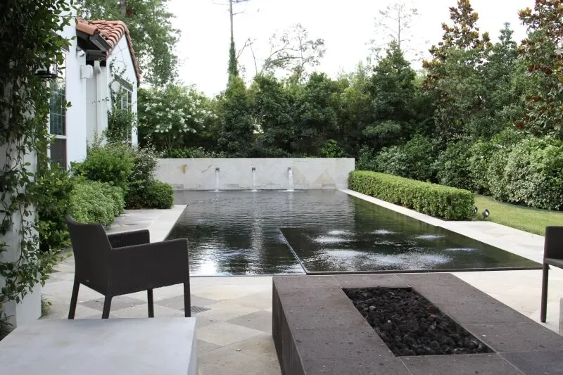 Modern geometric luxury backyard pool with water features and geometric design elements